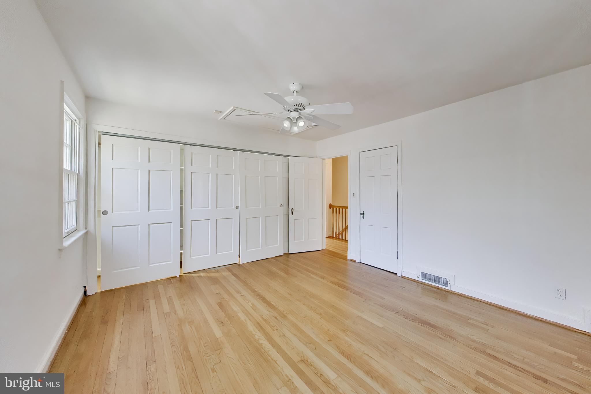 5138 Nebraska Avenue Northwest Washington, DC 20008 - Photo 20 of 39 a view of an empty room and wooden floor