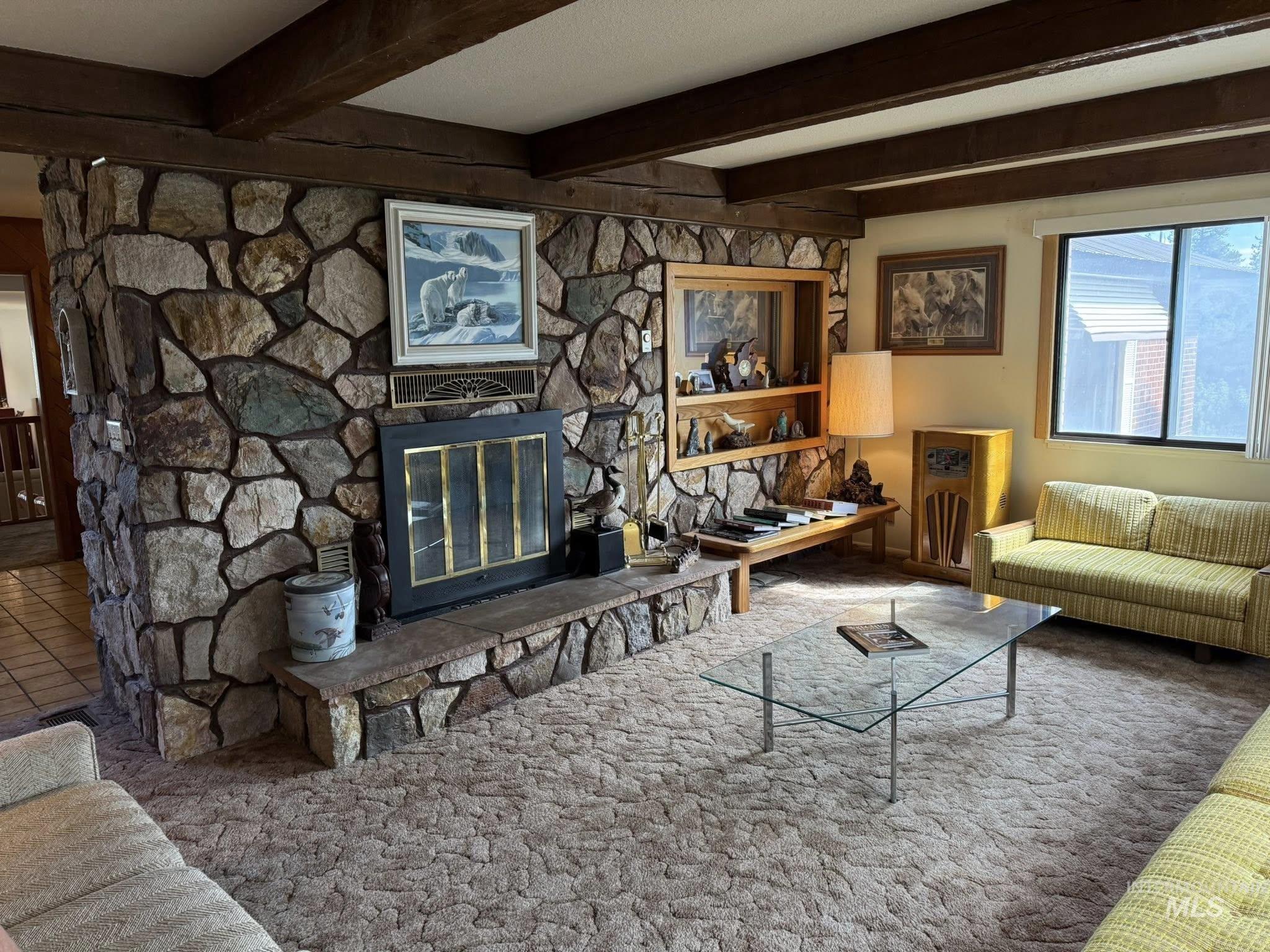 11100 Bens Road Cascade, ID 83611 - Photo 20 of 35 Stone-clad fireplace with a raised hearth and built-in shelving