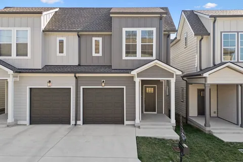 a front view of a house with a garage