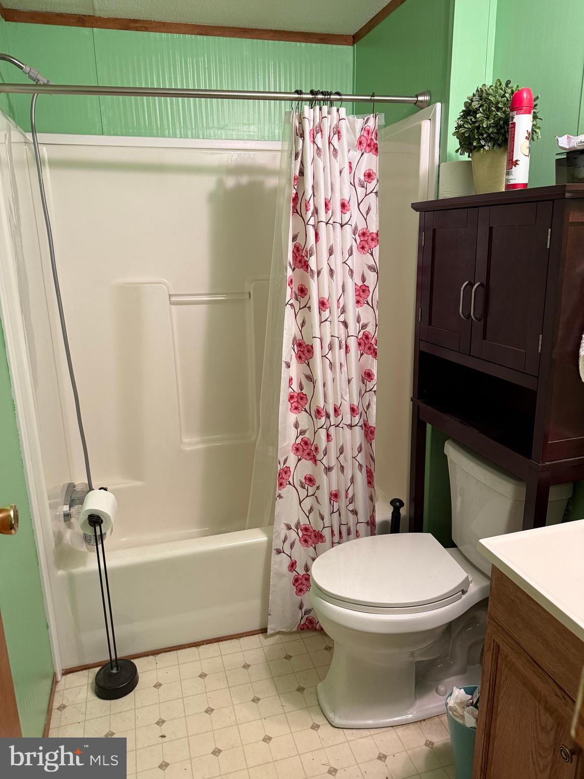 90 Knight Road, Unit TR 35 Gettysburg, PA 17325 - Photo 14 of 16 a white toilet sitting next to a shower curtain