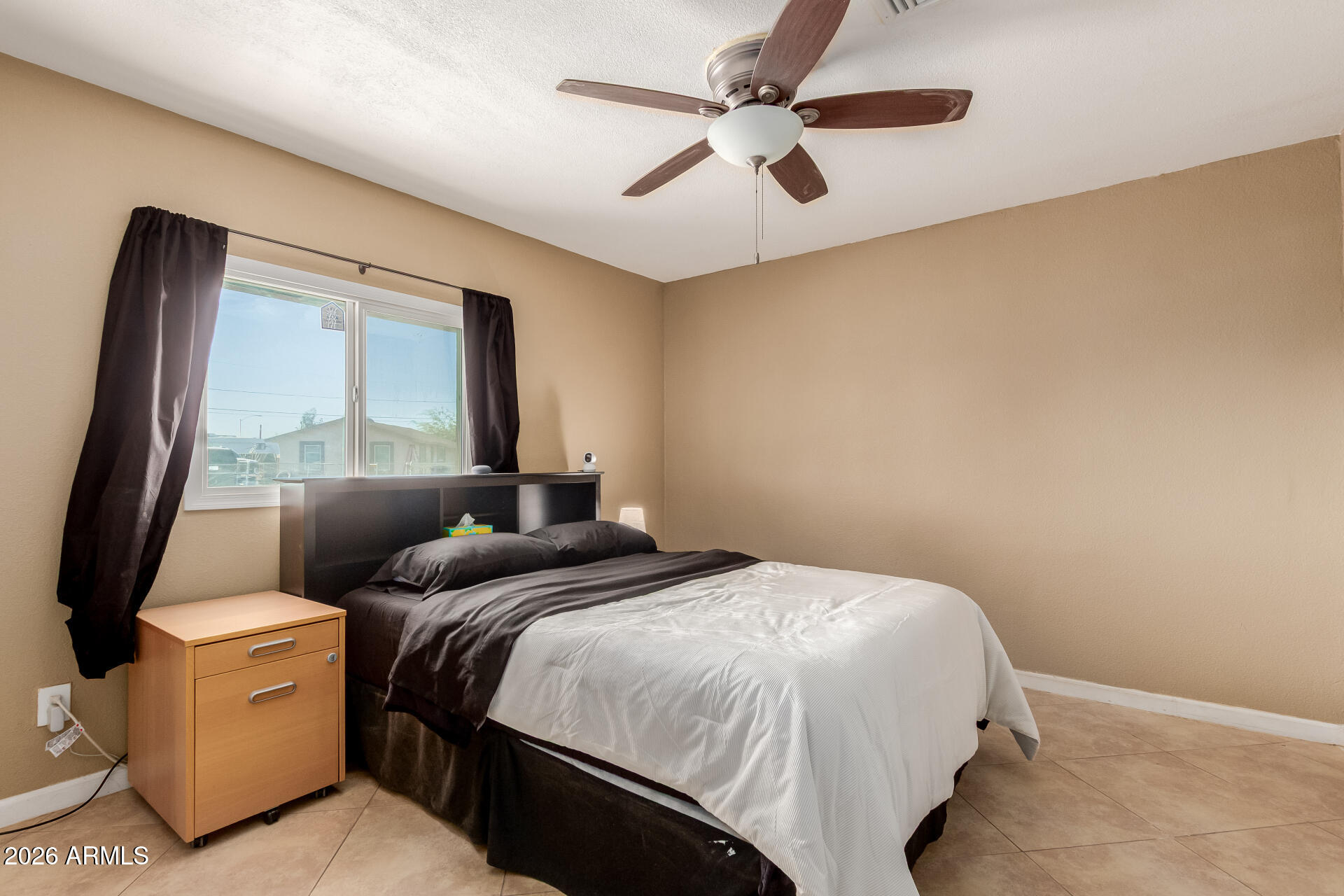 1644 West Sonora Street Phoenix, AZ 85007 - Photo 12 of 29 a bedroom with a bed and a large mirror