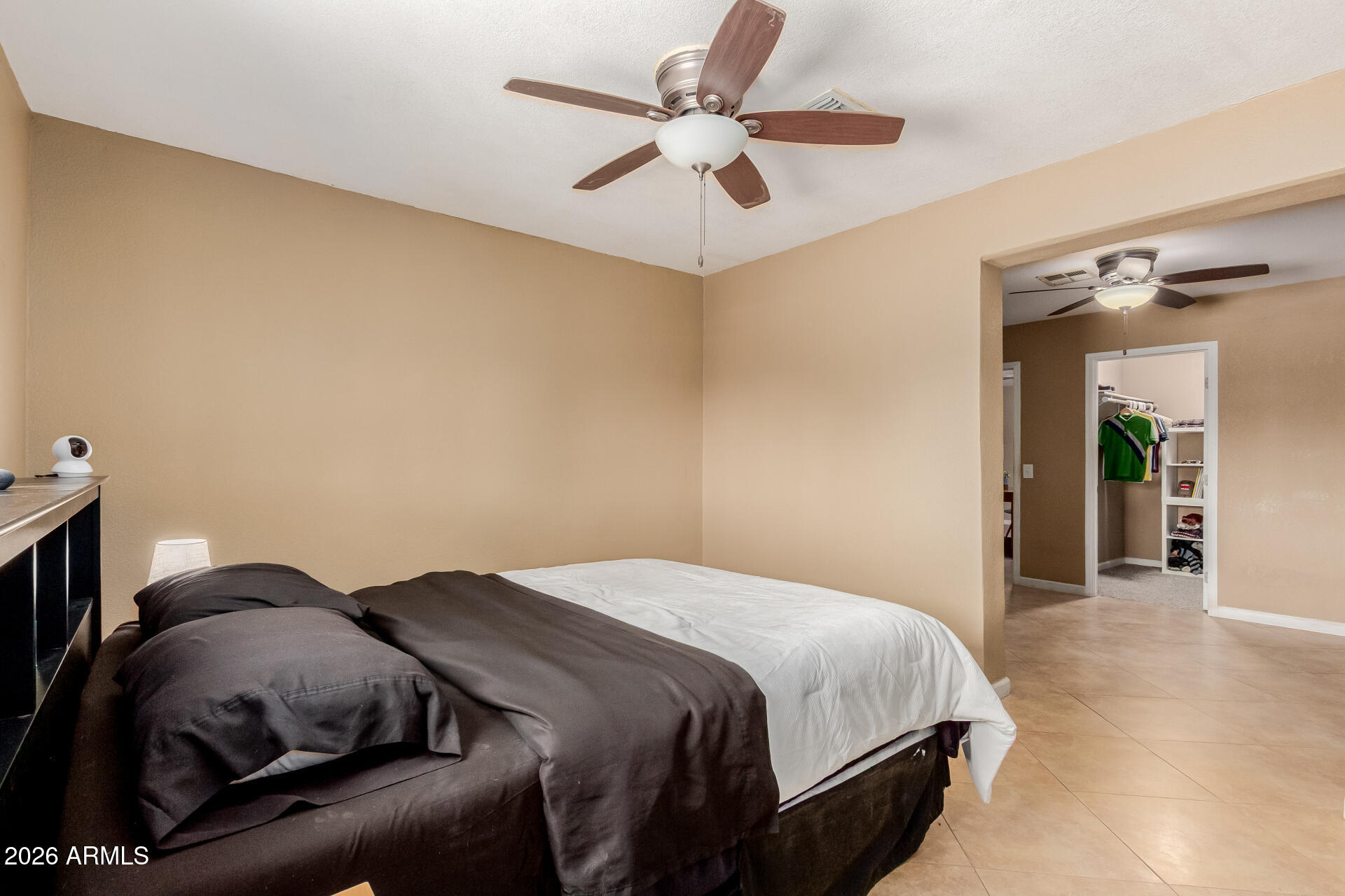 1644 West Sonora Street Phoenix, AZ 85007 - Photo 14 of 29 a bedroom with a bed and a ceiling fan