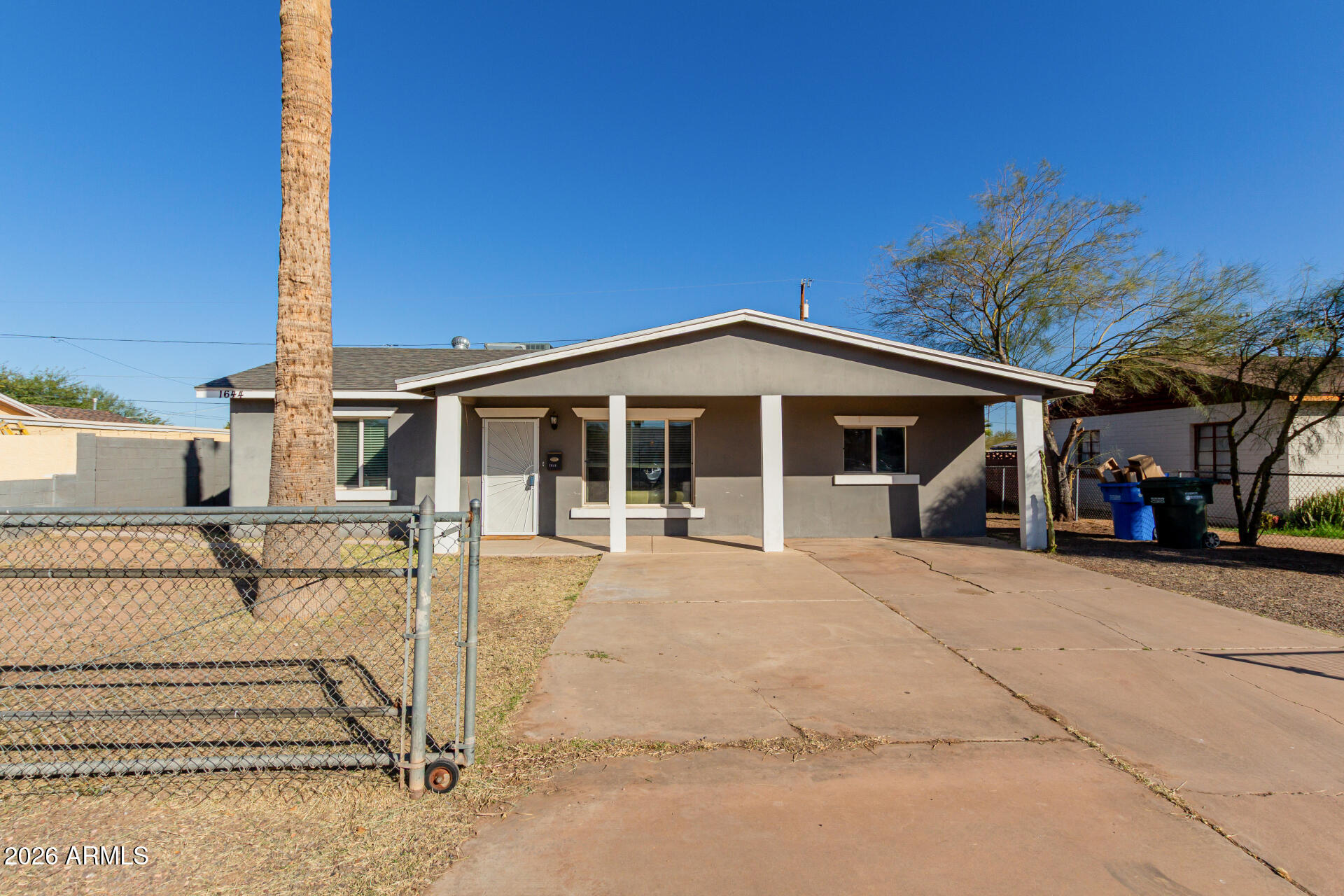 1644 West Sonora Street Phoenix, AZ 85007 - Photo 2 of 29 front view of a house with a patio