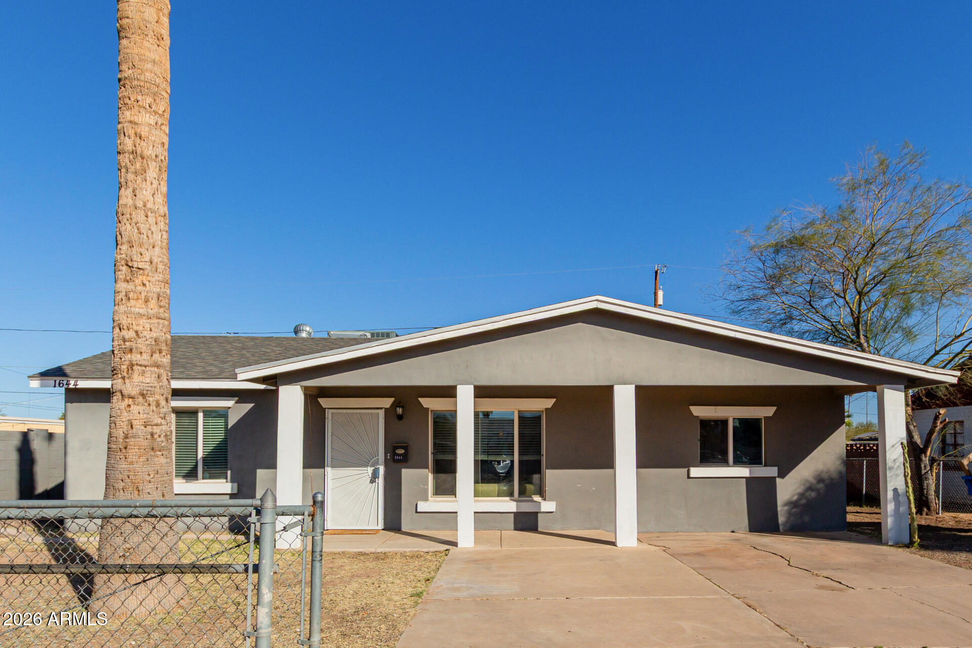 1644 West Sonora Street Phoenix, AZ 85007 - Photo 25 of 29 a view of a house with wooden walls and floor to ceiling window