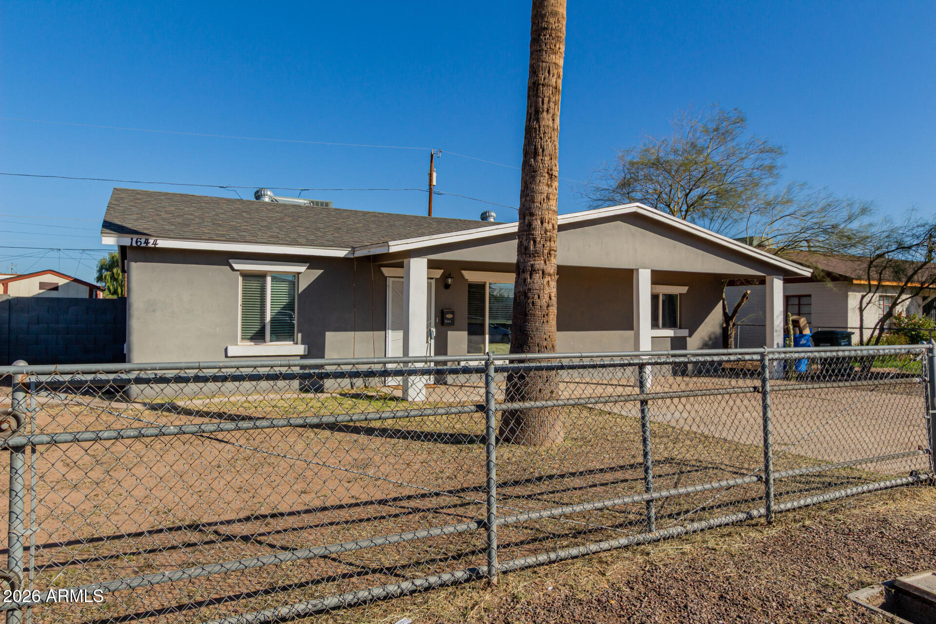 1644 West Sonora Street Phoenix, AZ 85007 - Photo 26 of 29 a view of a house with a backyard