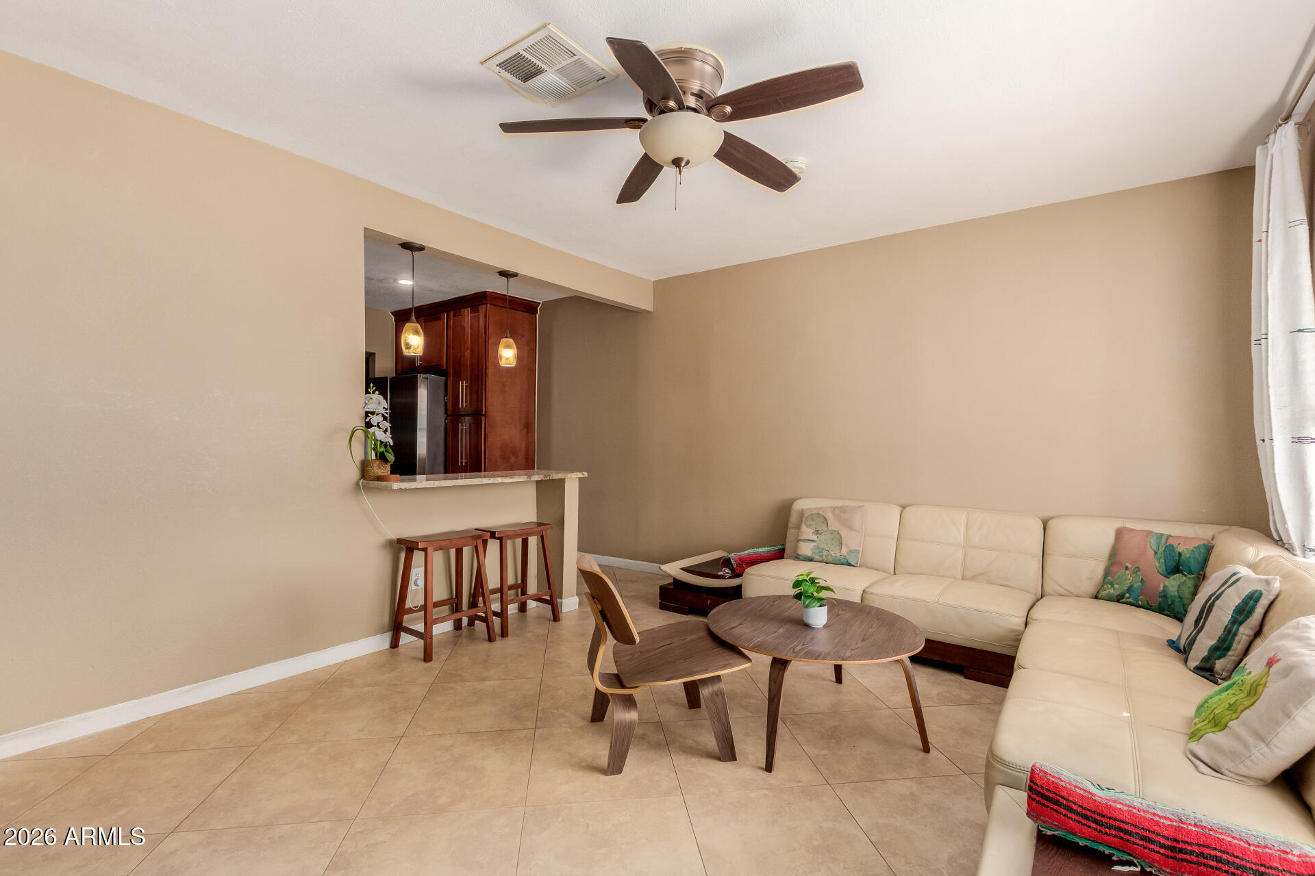 1644 West Sonora Street Phoenix, AZ 85007 - Photo 3 of 29 a living room with furniture and a ceiling fan