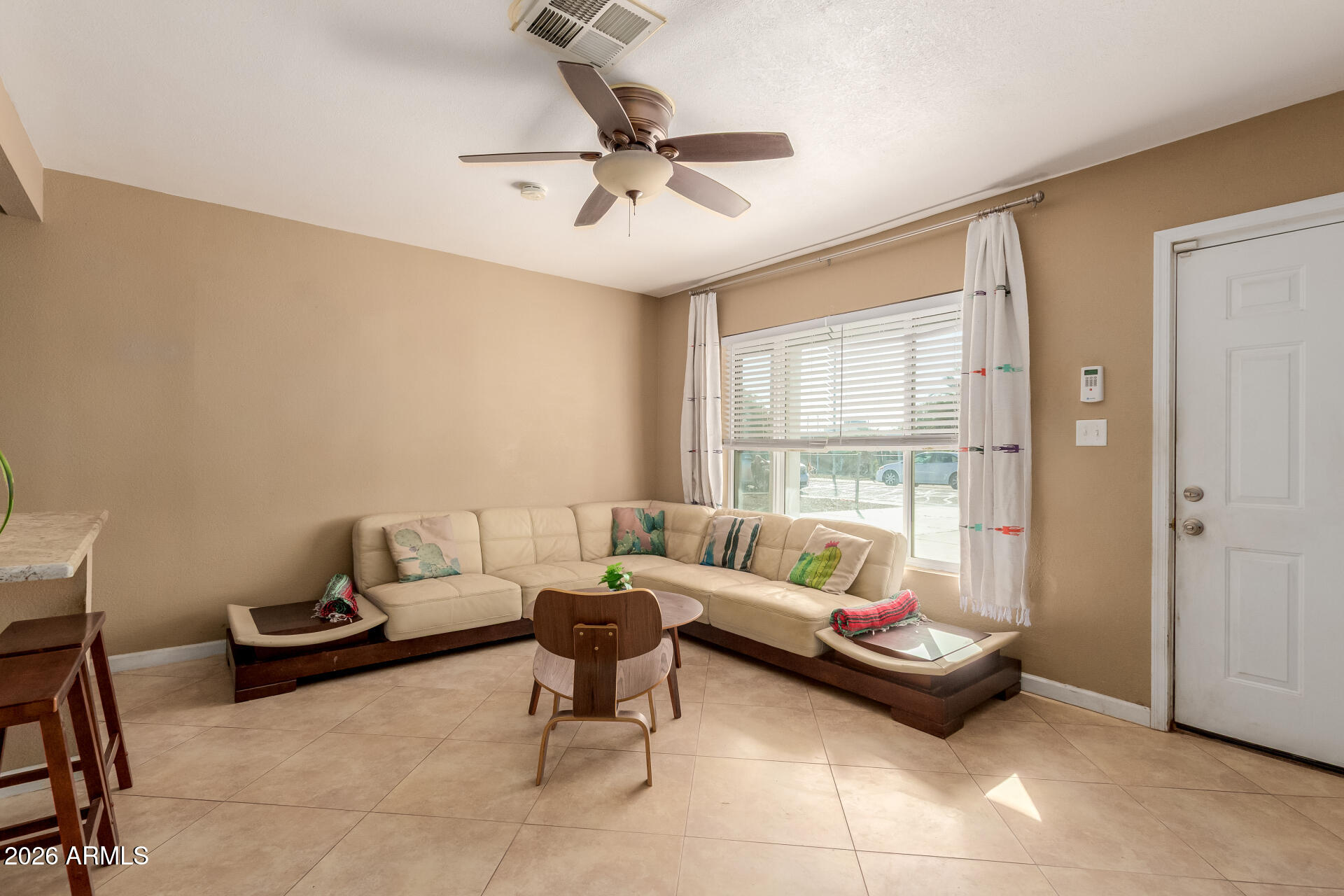 1644 West Sonora Street Phoenix, AZ 85007 - Photo 4 of 29 a living room with furniture and a window