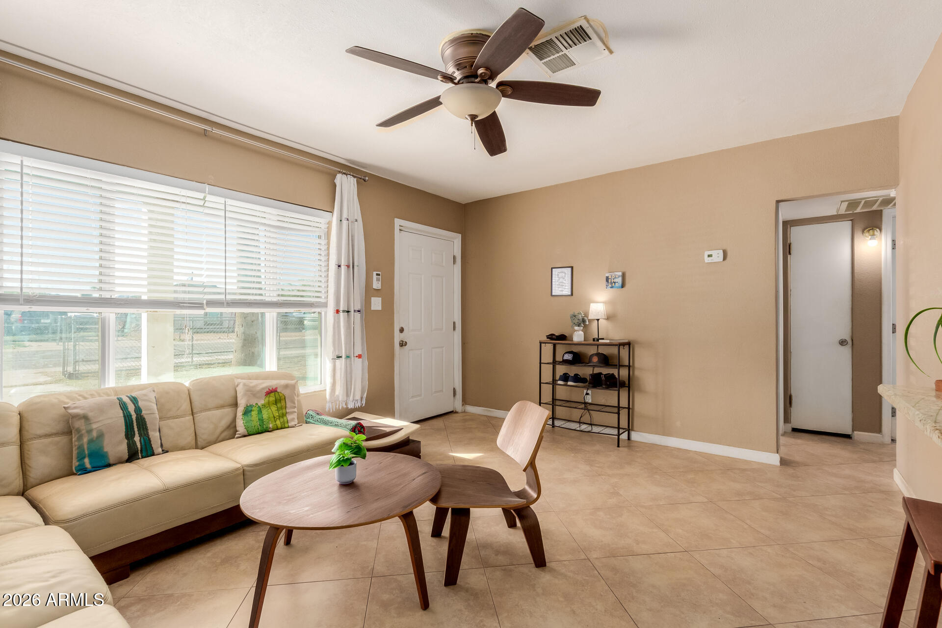 1644 West Sonora Street Phoenix, AZ 85007 - Photo 5 of 29 a living room with furniture and a large window