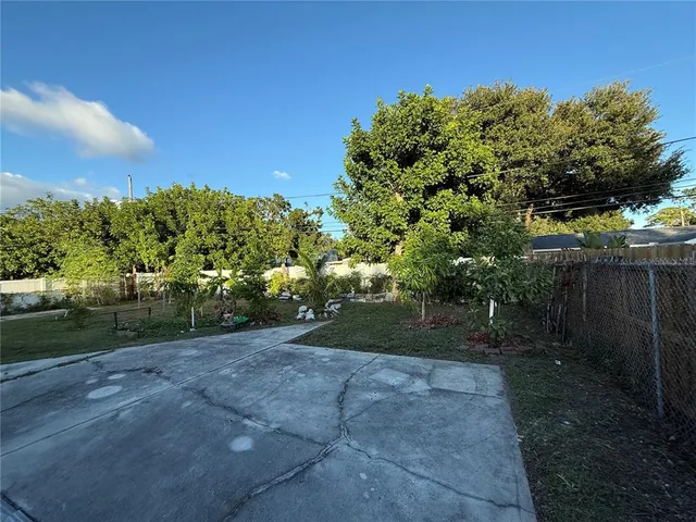 a view of backyard with green space
