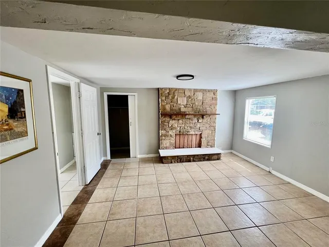 a view of an empty room and window