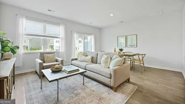 a living room with furniture and a window