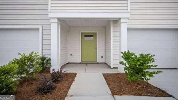 a view of a pathway along with potted plants