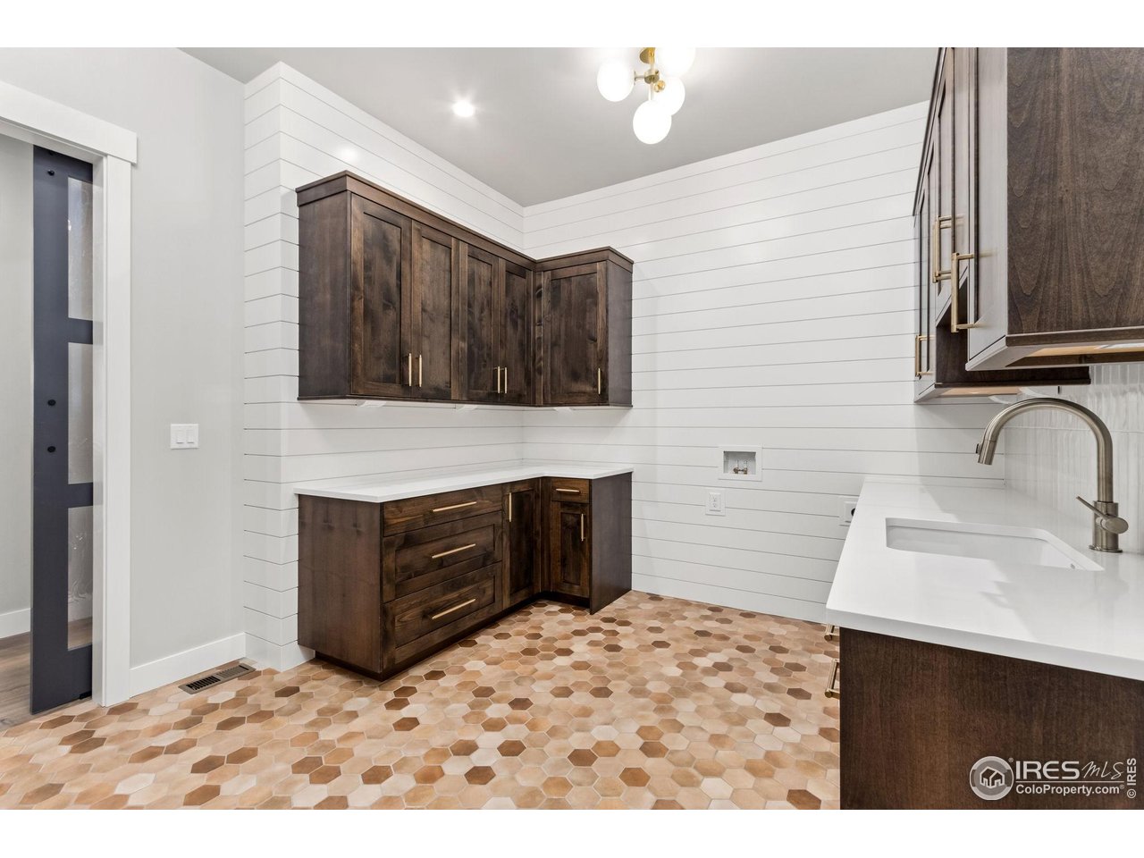 6325 Sanctuary Drive Windsor, CO 80550 - Photo 17 of 42 a bathroom with a sink a vanity and a mirror