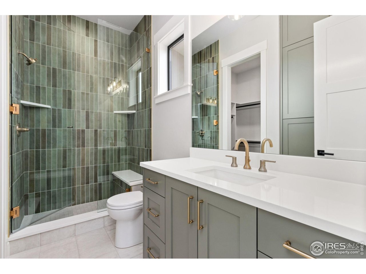6325 Sanctuary Drive Windsor, CO 80550 - Photo 20 of 42 a bathroom with a sink a toilet and shower
