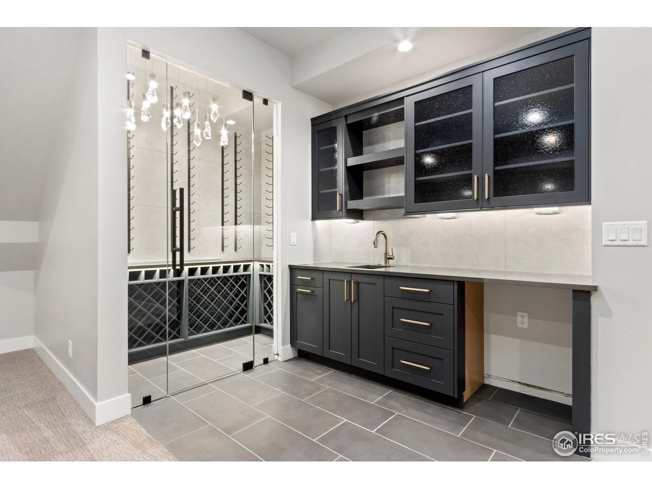 6325 Sanctuary Drive Windsor, CO 80550 - Photo 25 of 42 a bathroom with a sink a vanity and shower
