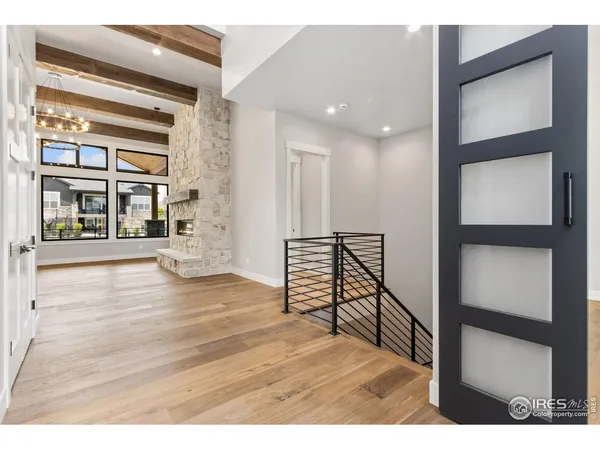 a view of an entryway with wooden floor