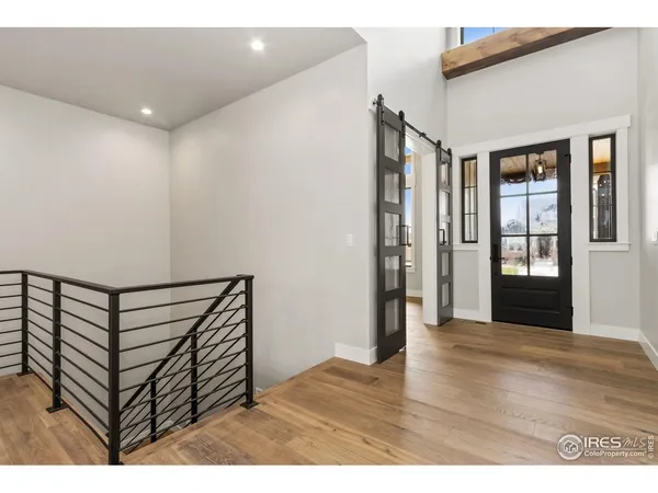 a view of entryway with wooden floor
