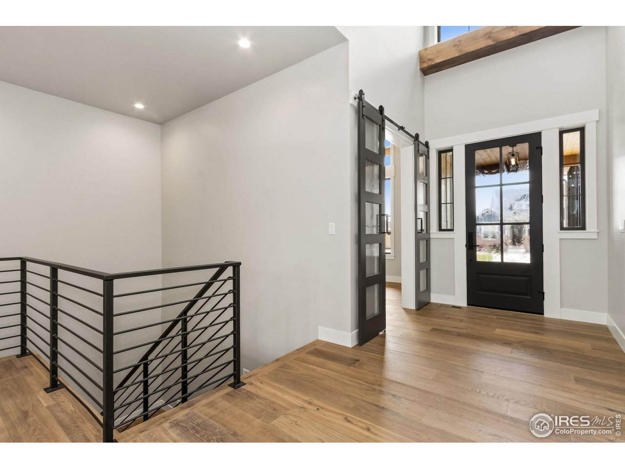 6325 Sanctuary Drive Windsor, CO 80550 - Photo 5 of 42 a view of entryway with wooden floor