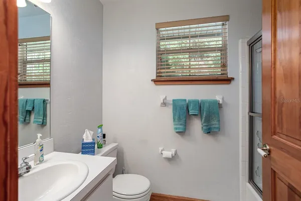 a view of a lake with houses in the back