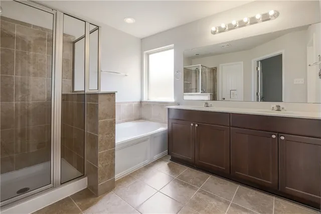 a bathroom with a bathtub and a sink