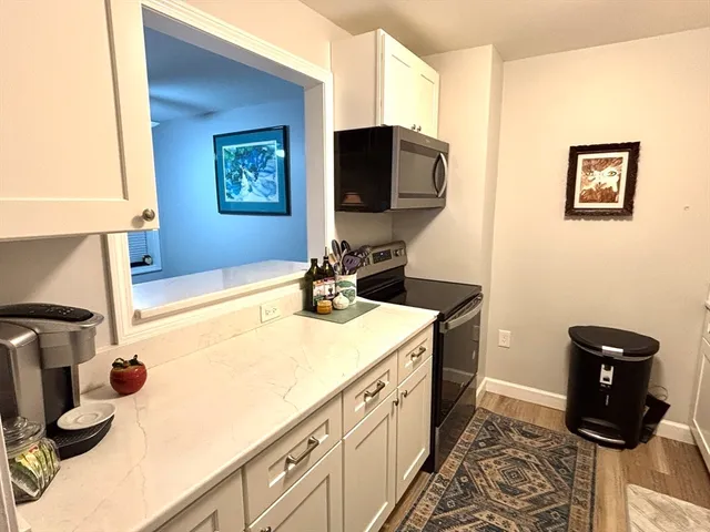 a kitchen with stainless steel appliances a refrigerator and a sink
