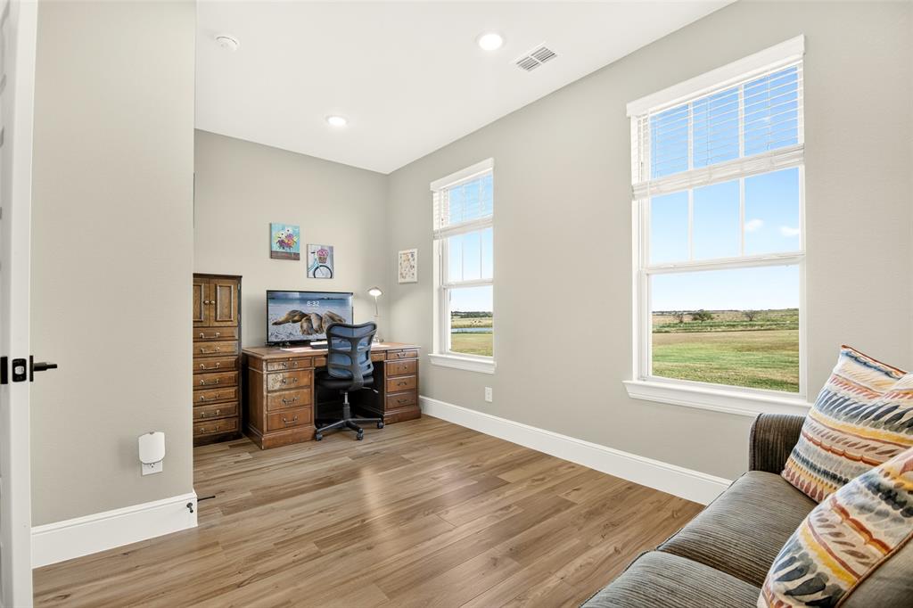 10828 Gregory Road Sanger, TX 76266 - Photo 19 of 37 Wood-finish flooring, recessed lighting, and multiple windows with outdoor scenery