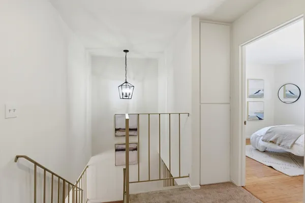 a bedroom with furniture and a window