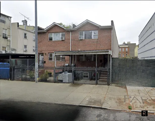 a front view of a house with parking