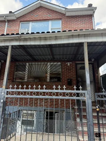 a front view of a building with parking space