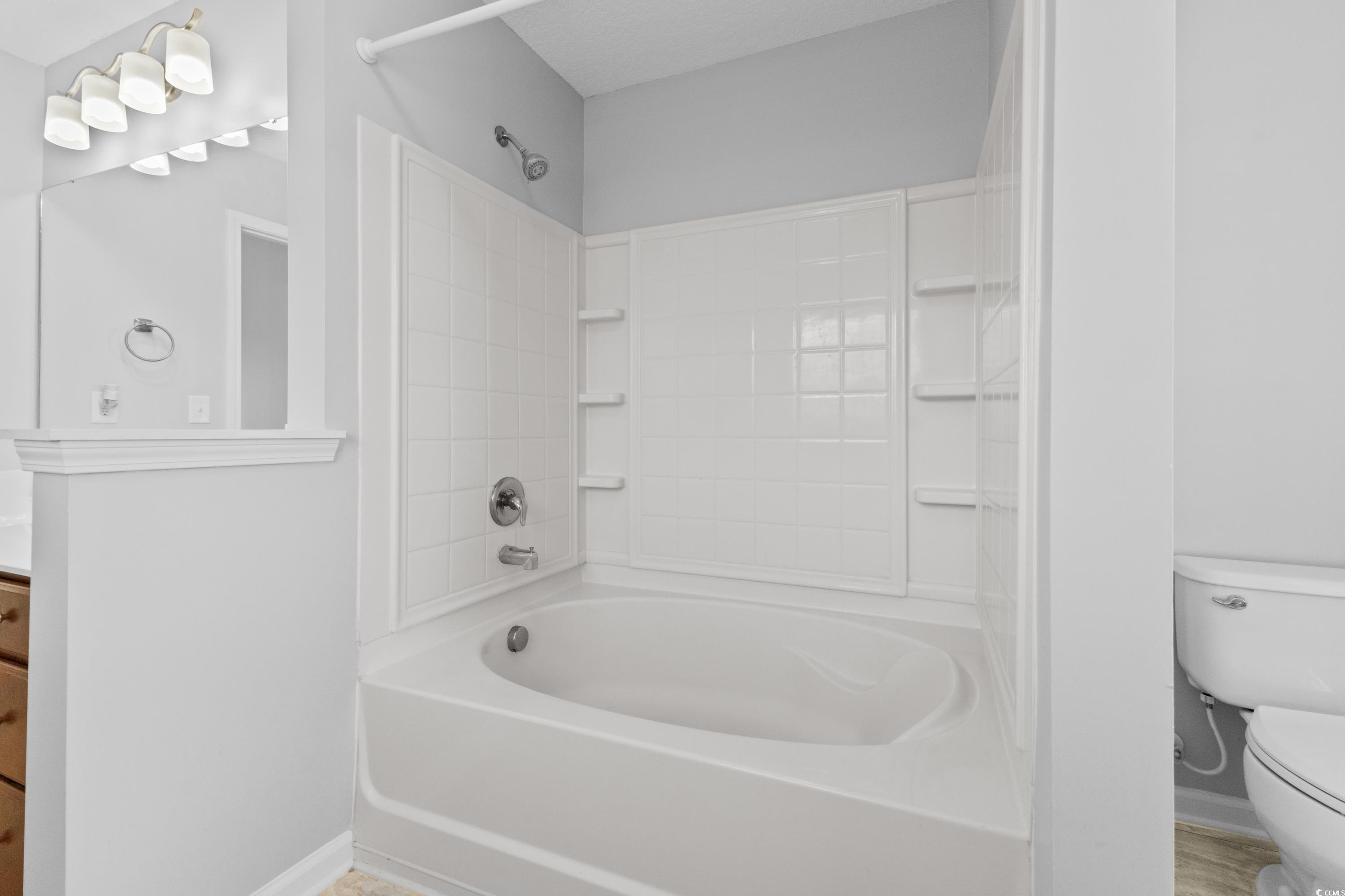 356 Whipple Run Loop Myrtle Beach, SC 29588 - Photo 25 of 40 Full bathroom with toilet, vanity, shower / bathing tub combination, and baseboards