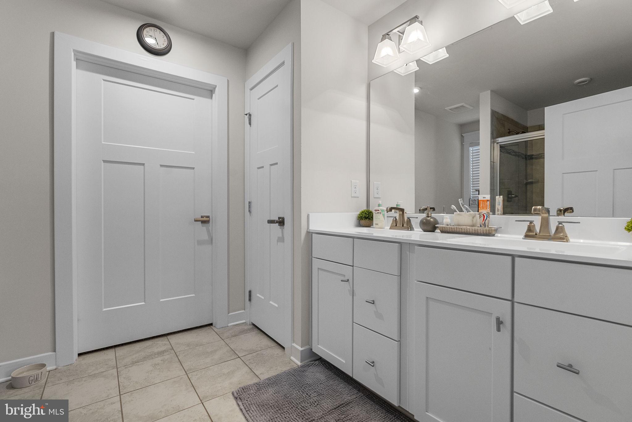 80 Senators Way Berlin, NJ 08009 - Photo 22 of 29 a bathroom with a double vanity sink and a mirror