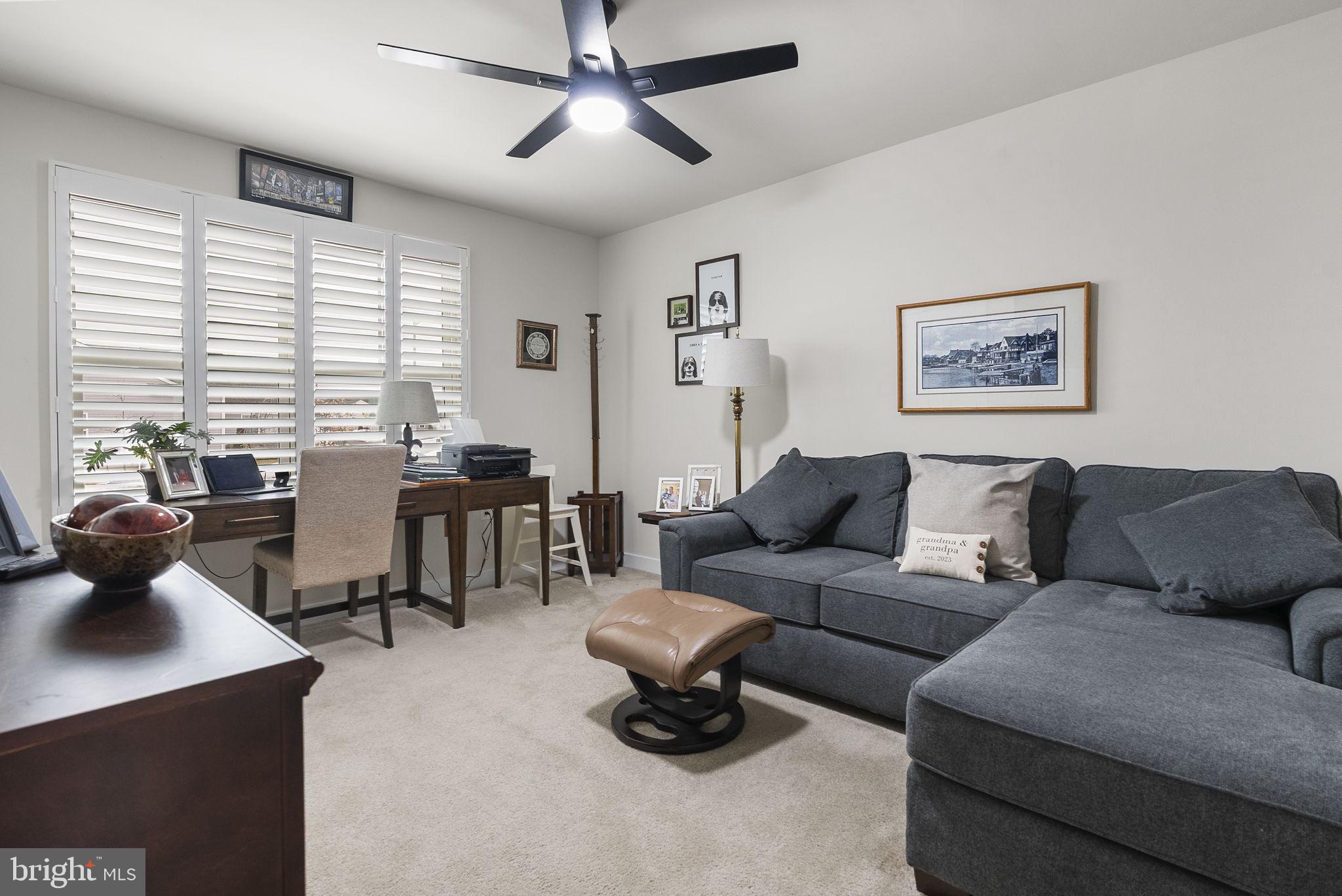 80 Senators Way Berlin, NJ 08009 - Photo 7 of 29 a living room with furniture and a large window