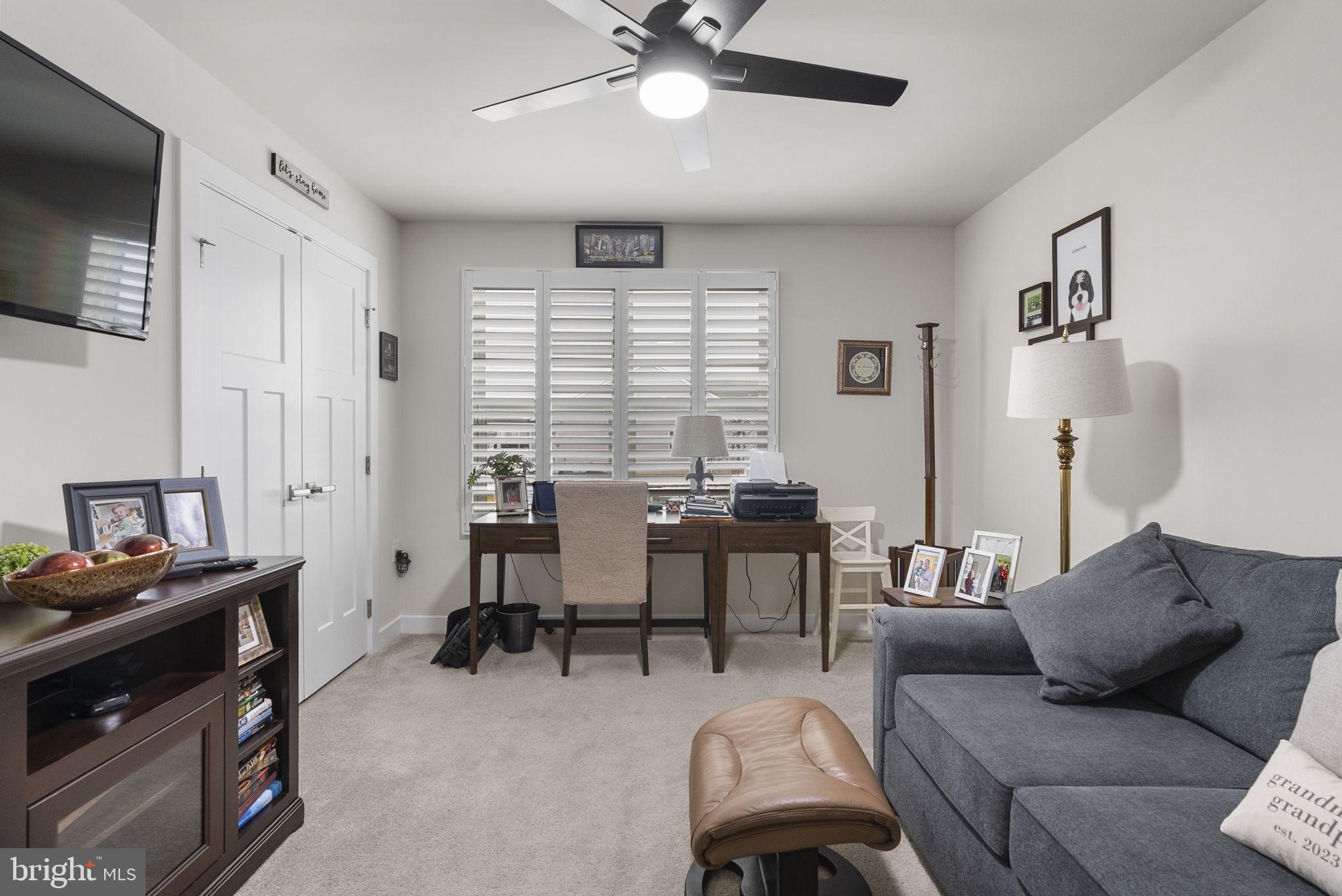 80 Senators Way Berlin, NJ 08009 - Photo 8 of 29 a living room with furniture and a flat screen tv