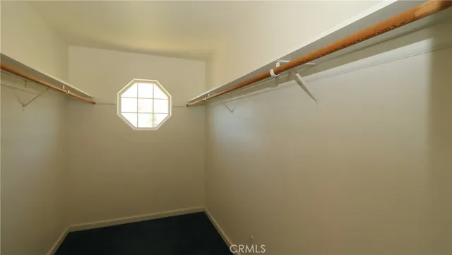 a view of small space with a dishwasher and a window