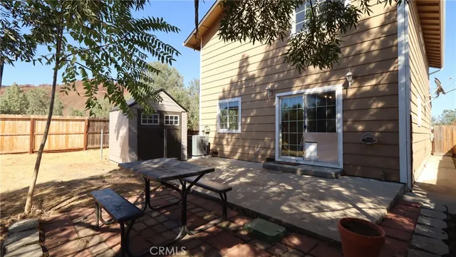 a view of a backyard with sitting area