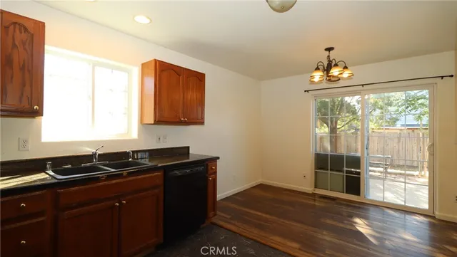 a kitchen that has a sink and a stove