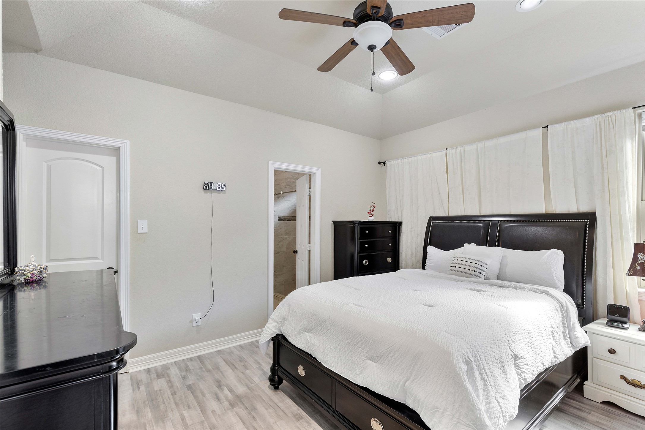 23741 Briar Tree Drive Porter, TX 77365 - Photo 18 of 36 a bedroom with a bed and wooden floor