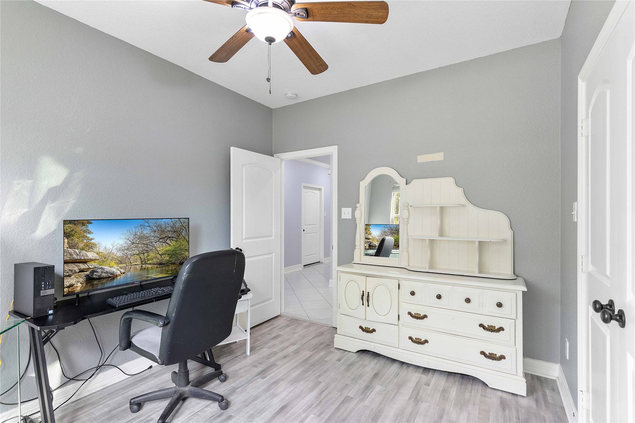 23741 Briar Tree Drive Porter, TX 77365 - Photo 24 of 36 a view of a workspace with furniture and a flat screen tv