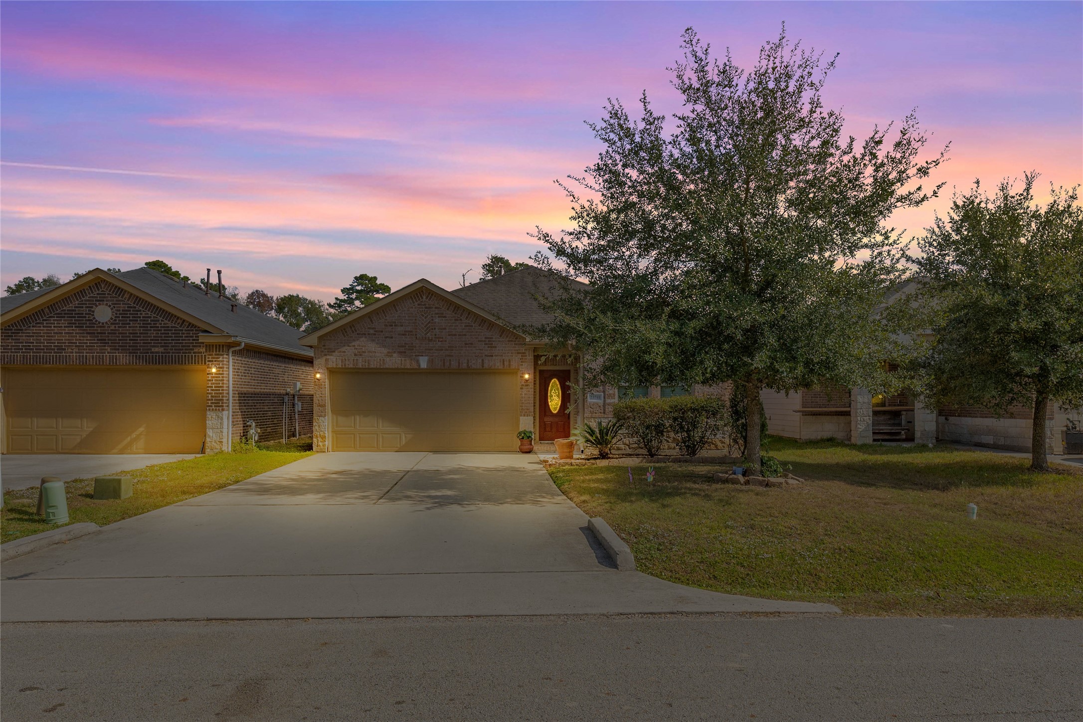 23741 Briar Tree Drive Porter, TX 77365 - Photo 3 of 36 a front view of a house with a yard and garage