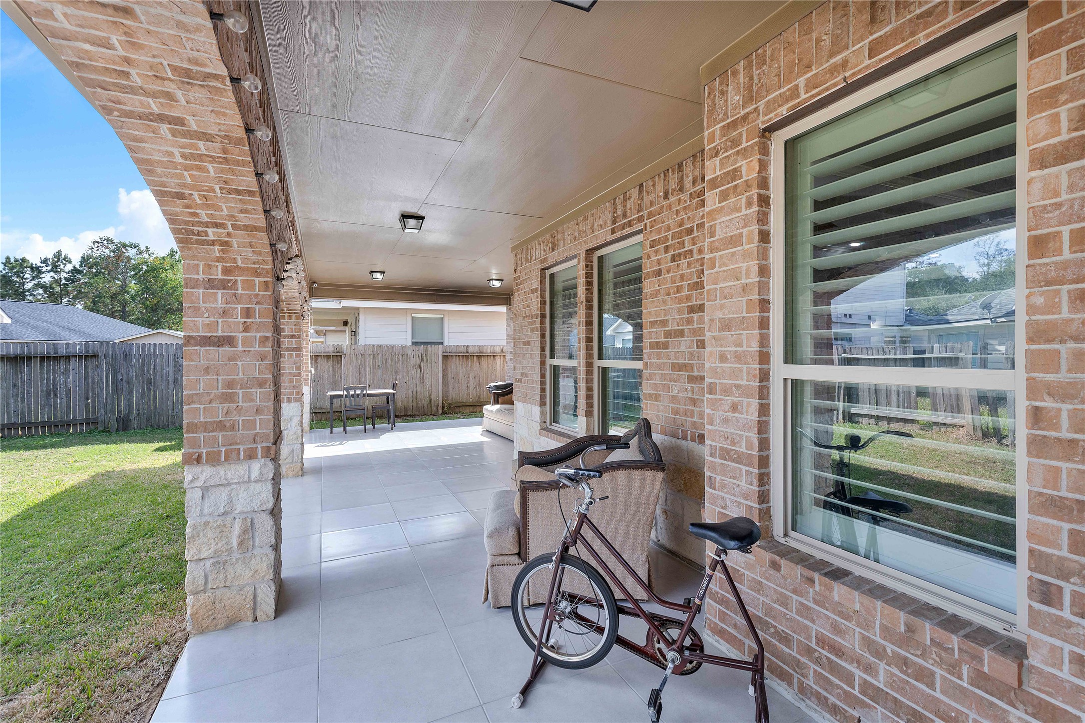 23741 Briar Tree Drive Porter, TX 77365 - Photo 35 of 36 a view of a patio with table and chairs and potted plants