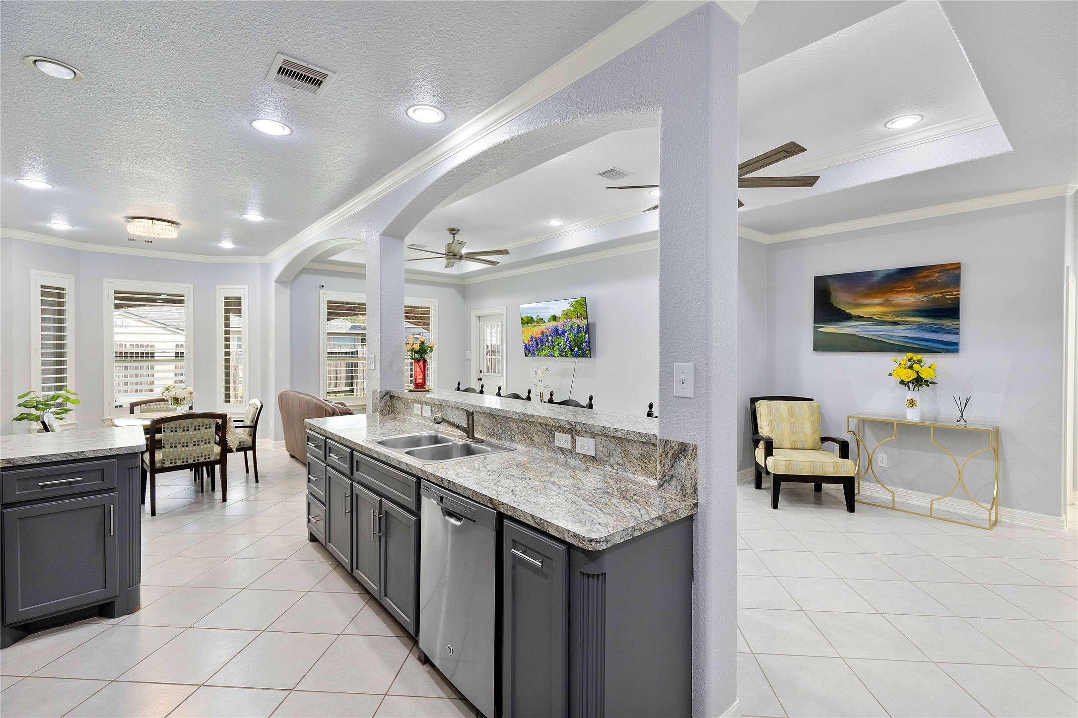23741 Briar Tree Drive Porter, TX 77365 - Photo 7 of 36 a kitchen with a stove a sink a dining table and chairs