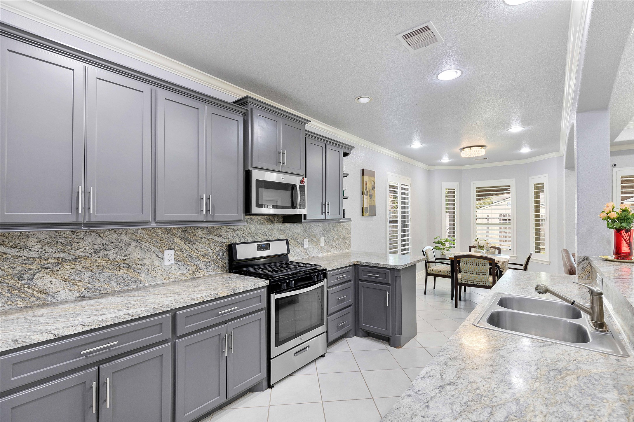 23741 Briar Tree Drive Porter, TX 77365 - Photo 8 of 36 a kitchen with stainless steel appliances granite countertop a sink stove and cabinets