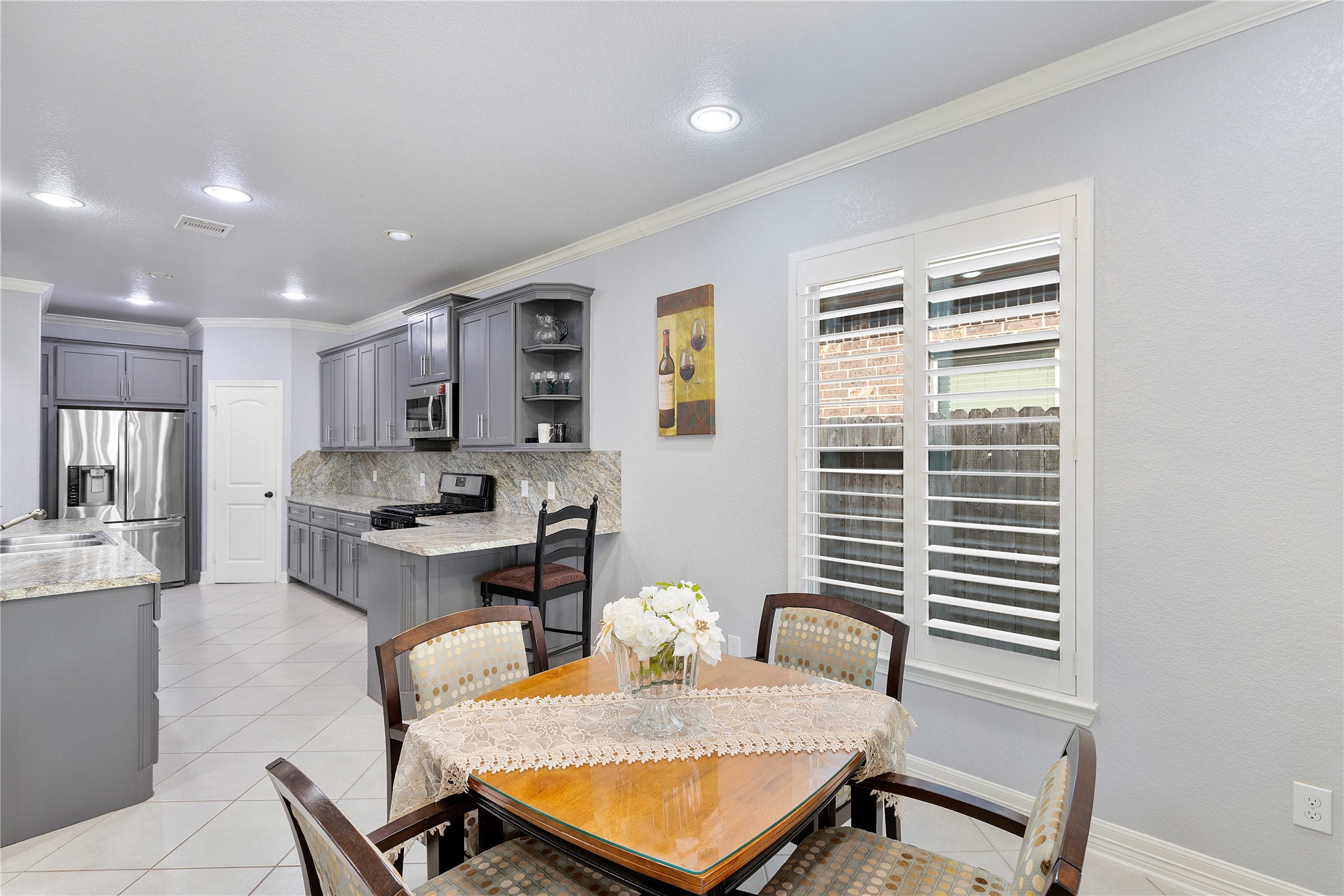 23741 Briar Tree Drive Porter, TX 77365 - Photo 10 of 36 a living room with furniture a dining table and kitchen view