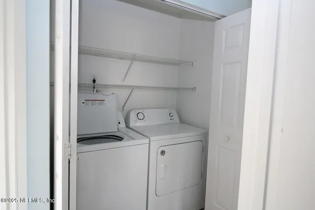 a utility room with dryer and washer