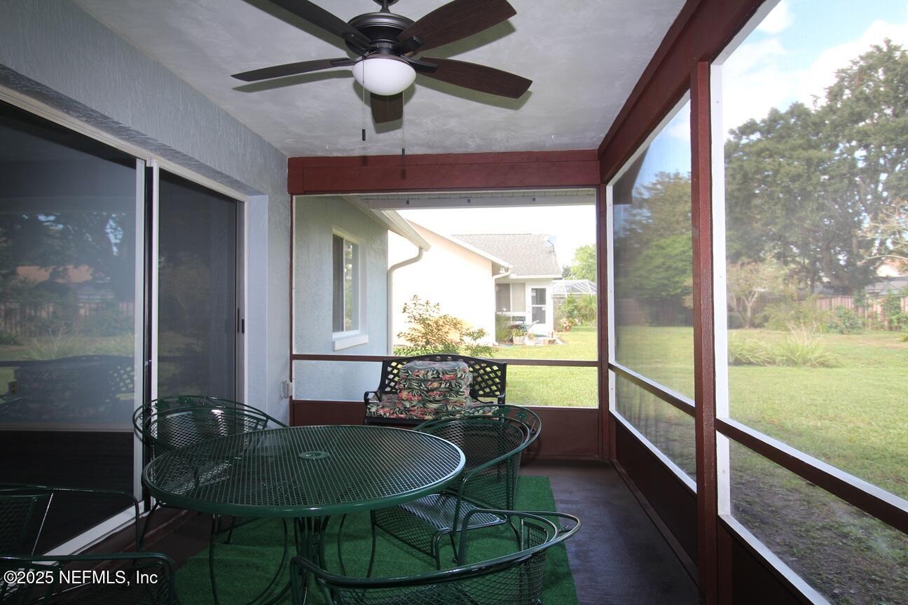 48 Westover Lane Palm Coast, FL 32164 - Photo 18 of 20 a view of a dining room with furniture window and wooden floor