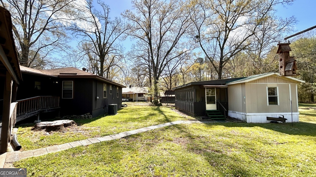 67 Dixie Park Drive Northwest Rome, GA 30165 - Photo 23 of 37 a view of a yard with a large tree