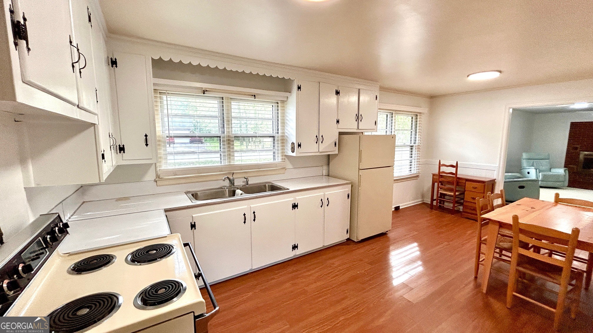 67 Dixie Park Drive Northwest Rome, GA 30165 - Photo 4 of 37 a kitchen with stainless steel appliances a center island sink and wooden floor