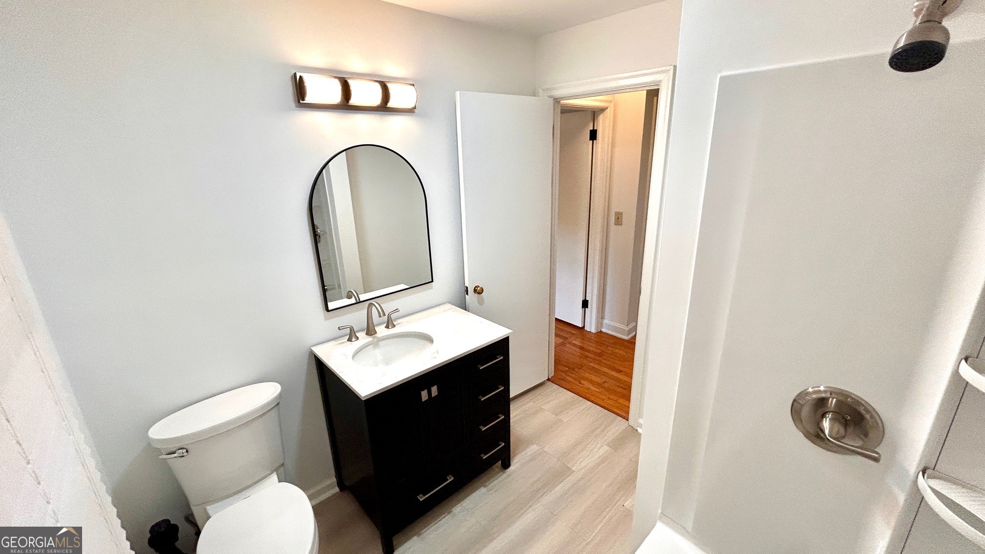 67 Dixie Park Drive Northwest Rome, GA 30165 - Photo 5 of 37 a bathroom with a toilet sink and mirror