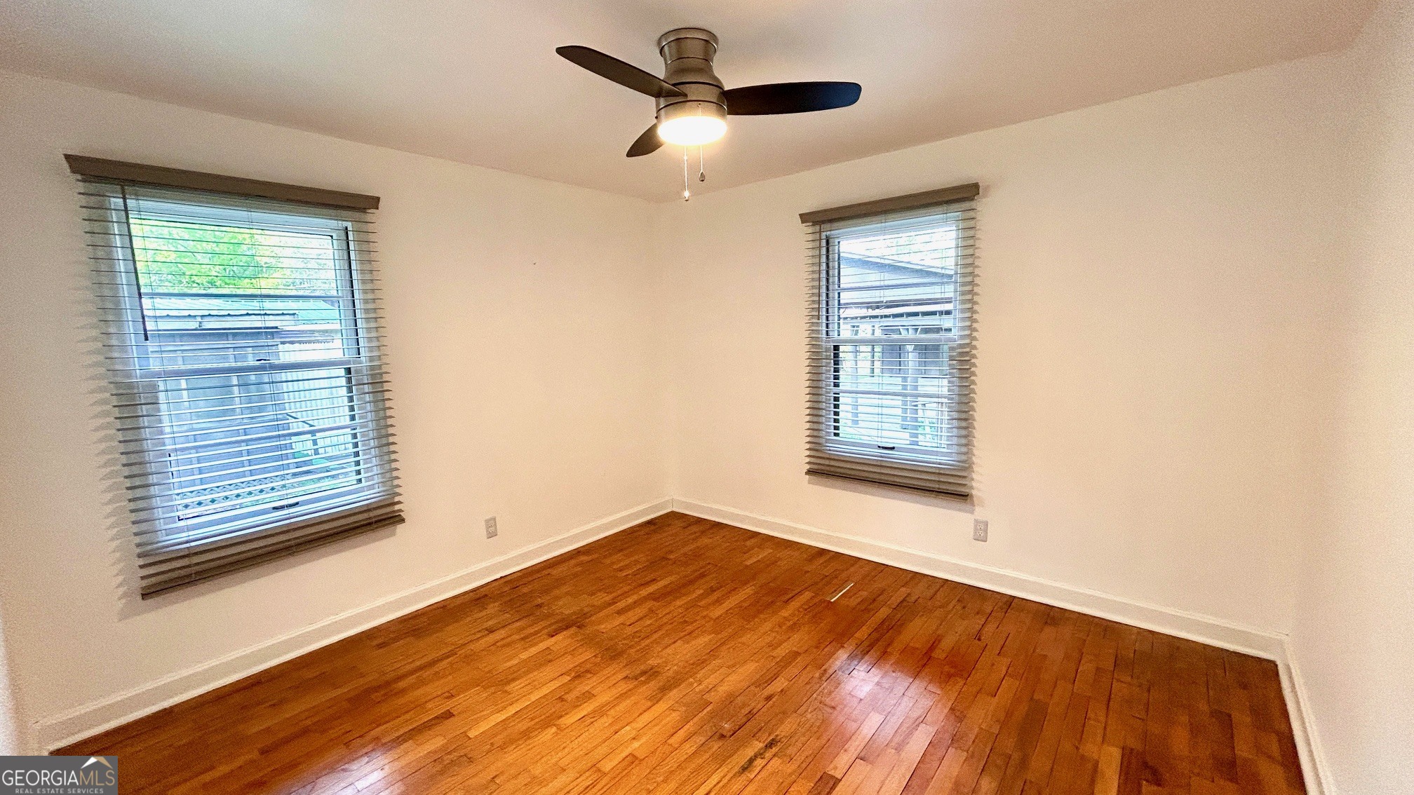 67 Dixie Park Drive Northwest Rome, GA 30165 - Photo 9 of 37 a view of empty room with wooden floor and fan