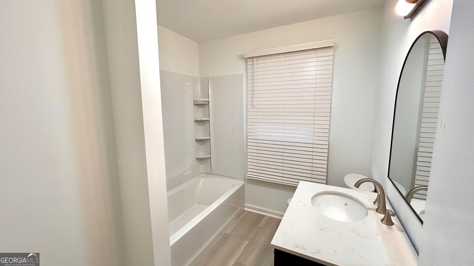 67 Dixie Park Drive Northwest Rome, GA 30165 - Photo 10 of 37 a bathroom with a tub sink and a mirror